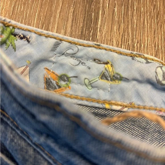 PAIGE Distressed Medium Blue Denim Shorts - Picture 5 of 8